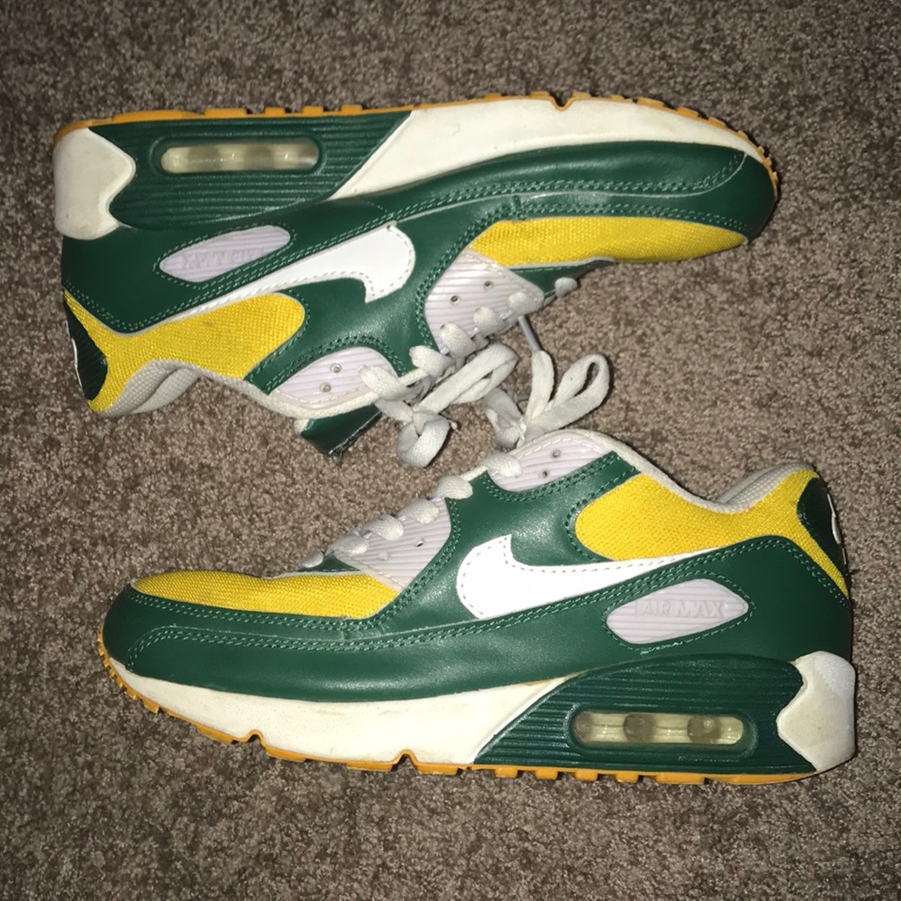 Green, gold, and white Nike Air Max